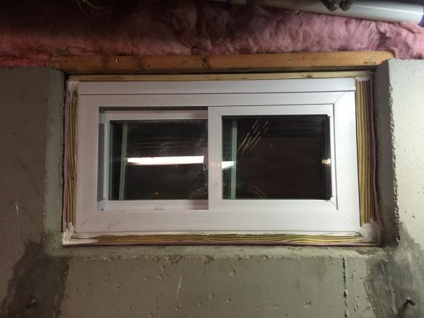 How do you replace a basement window in a concrete foundation