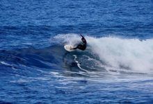 What is the proper foot placement on a surfboard