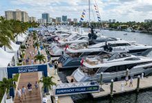 Luxury superyachts docked along the floating marina at the Superyacht Village during FLIBS 2026 in Fort Lauderdale, Florida