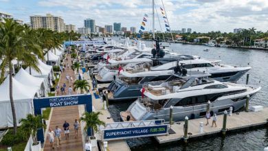 Luxury superyachts docked along the floating marina at the Superyacht Village during FLIBS 2026 in Fort Lauderdale, Florida