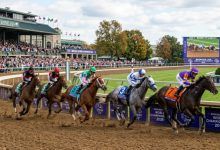 Thoroughbred racehorses rounding the final turn at Keeneland Race Course in Lexington, Kentucky, during the Breeders Cup World Championships 2026