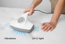 UV-C mattress vacuum removing dust and allergens from a bed
