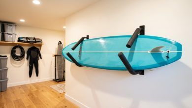 Surfboard stored safely on an indoor wall rack.