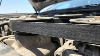 Mechanic inspecting a serpentine belt in Phoenix
