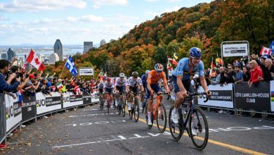 Elite cyclists climbing the steep Côte Camillien-Houde on Mont Royal during the men's road race at the UCI Road World Championships 2026 in Montréal, Canada