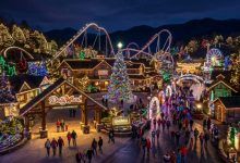 Dollywood theme park lit up with millions of colorful Christmas lights at night during the Smoky Mountain Christmas festival