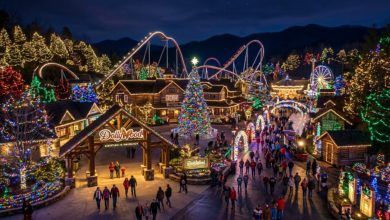 Dollywood theme park lit up with millions of colorful Christmas lights at night during the Smoky Mountain Christmas festival