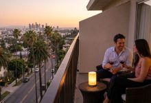 Romantic couple sharing an emotional conversation overlooking the Pacific Ocean coastline