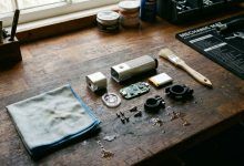 Microfiber cloth and brush cleaning a disassembled bike light