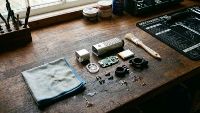 Microfiber cloth and brush cleaning a disassembled bike light